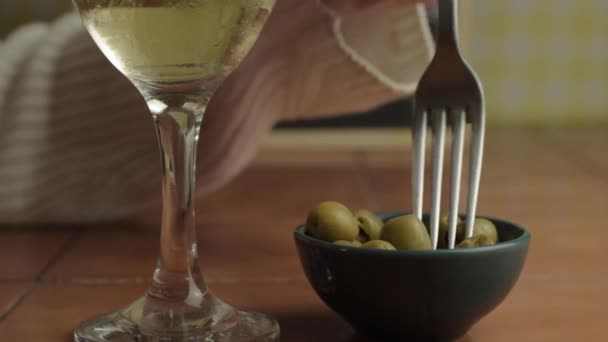 Hand Glass White Wine Eating Green Olives Fork — Vídeo de stock