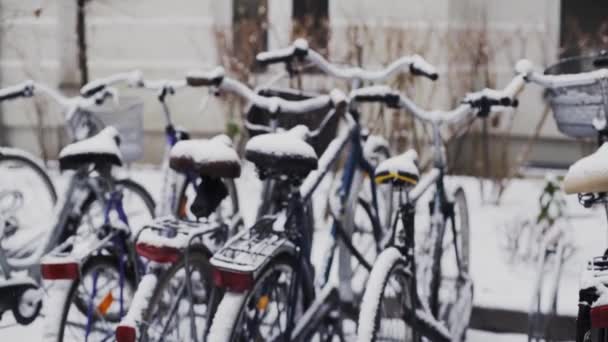 Snow Falling Group City Bikes Parked Bicycle Rack Winter — Stockvideo