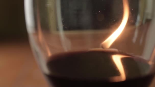 Red Wine Glass Warm Candle Reflections Close — Stockvideo