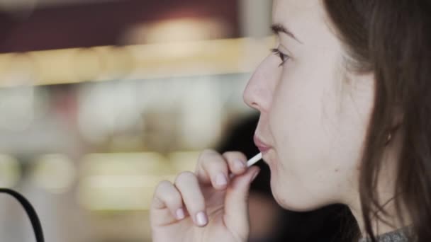 Girl Sucking Lollipop Taking Out Mouth Looking Camera Slow Motion — Video