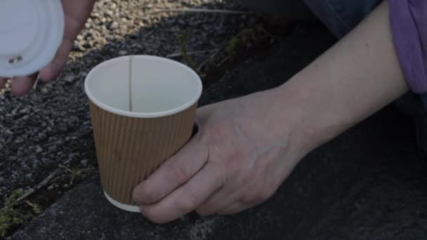 Sitting Sidewalk Drinking Takeout Coffee Close Shot — Videoclip de stoc