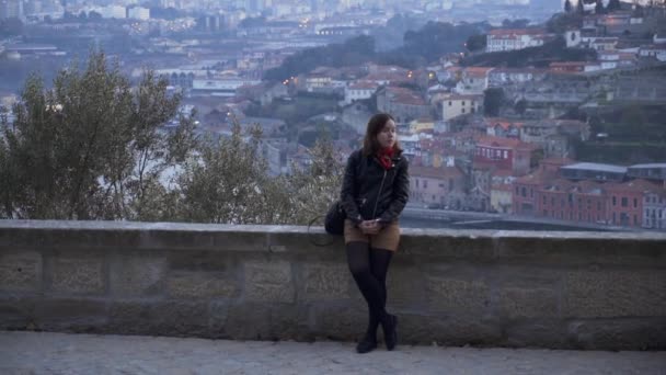 Girl Leaning Stone Wall Looks Camera Porto Background — Vídeos de Stock