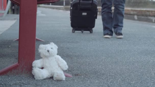 Teddy Left Train Platform Commuter Goes Suitcase Medium Shot — ストック動画