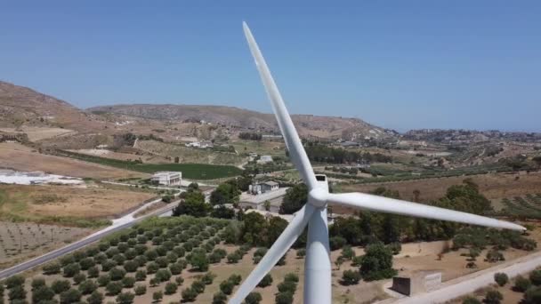 Aerial Wind Turbine Turning Mediterranean Hillside Closeup Reveal — Stockvideo