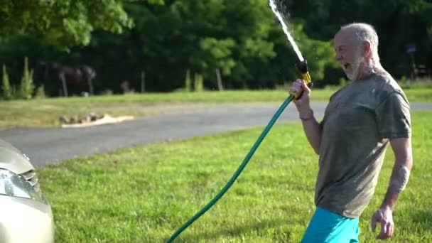 Crazy Man Hose Washing Car Flailing Water Air Slow Motion — Stok video