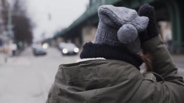 Girl Bobble Hat Winter Gloves Scratches Head Turns — Vídeos de Stock