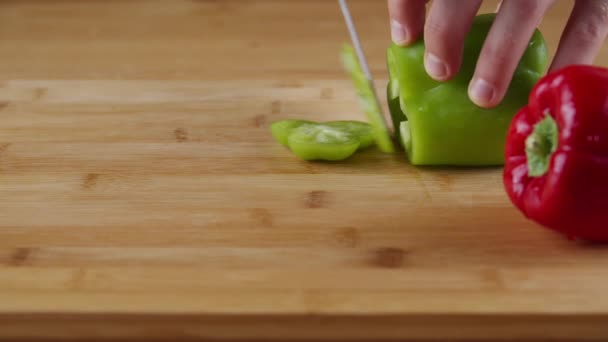 Woman Hand Cutting Green Red Bell Peppers Thin Slice Wooden — стоковое видео