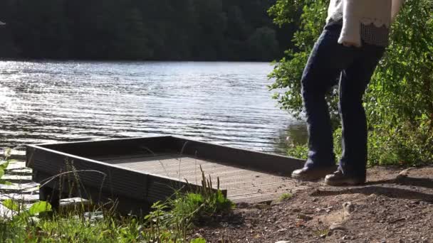 Woman Solitude Walks Pier Lake Wide Shot — Stockvideo