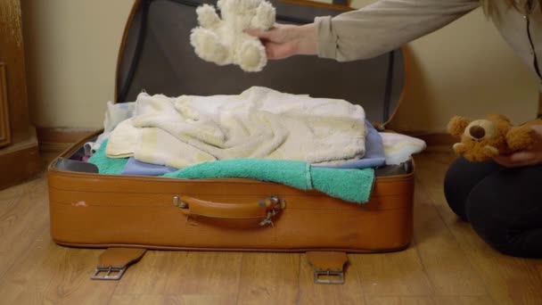 Parent Packing Children Toys Suitcase Wide Shot — Stock Video