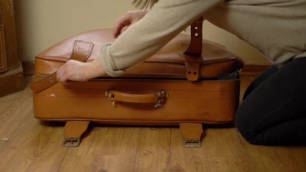 Woman Unzipping Old Brown Suitcase Wide Shot — Stock videók