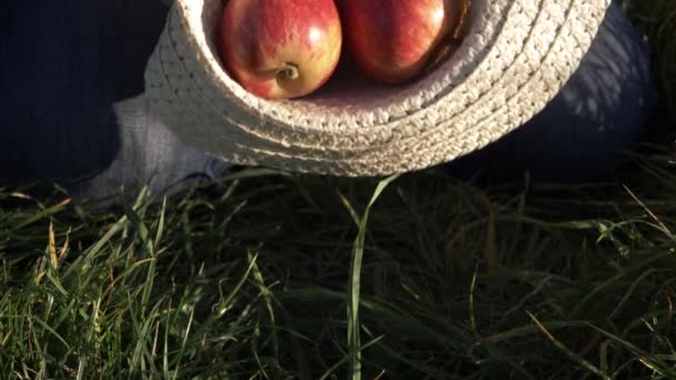 Ripe Red Apples Falling Straw Hat Medium Shot — Stock Video