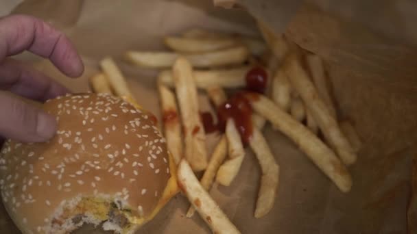 Hand Picking Cheeseburger Fries Medium Shot — Wideo stockowe