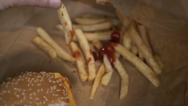 Hand Eating Cheeseburger Meal Fries Medium Shot — Wideo stockowe