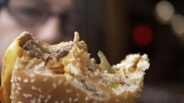 Woman Holding Out Cheese Burger Bites Taken Out Close Shot — Vídeos de Stock