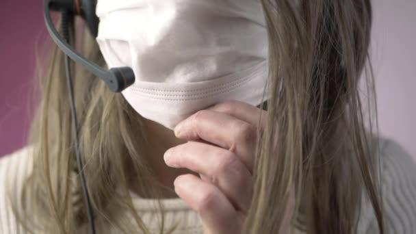 Woman Wearing Headset Adjusting Face Mask Close Shot — Αρχείο Βίντεο