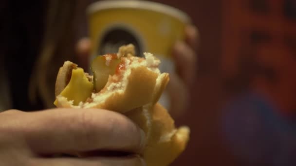 Woman Holding Cheese Burger Coffee Close Shot — Stockvideo