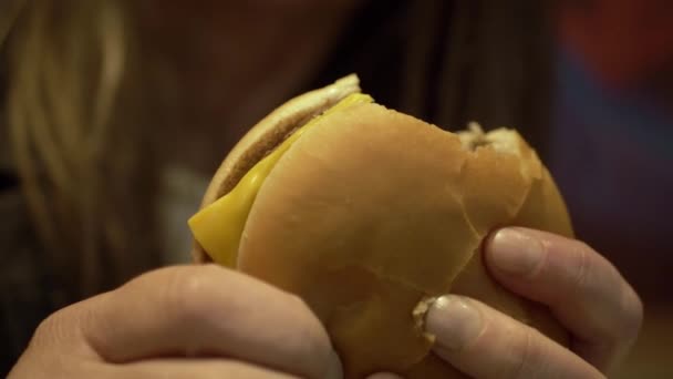 Woman Holding Cheese Burger Medium Shot — Stockvideo