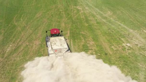 Farm Tractor Spreading White Powder Closeup Follow Flight — Stockvideo