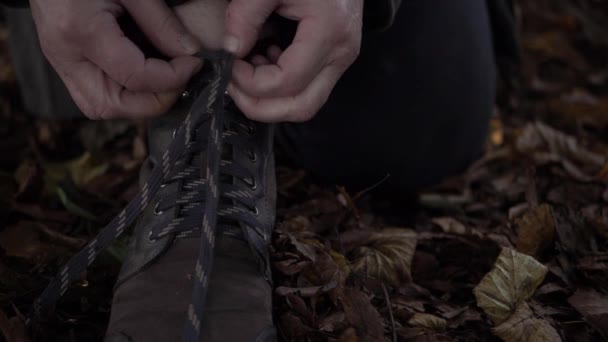 Hiker Tying Boot Laces Autumn Leaves Close Shot — Video Stock