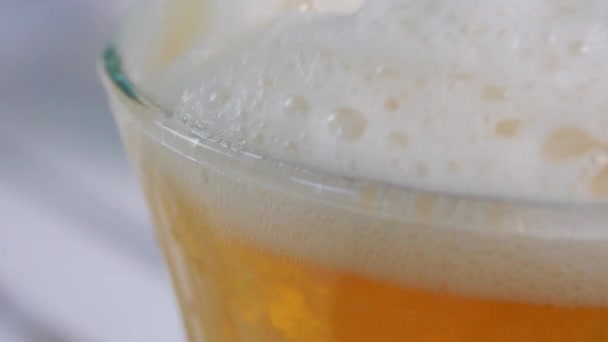 Top Beer Glass Closeup Displaying All Tiny Bubbles Bright White — Stockvideo