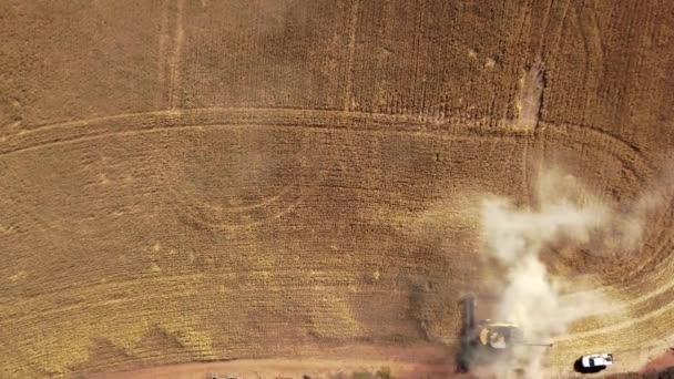 Straight Aerial View Combine Harvesting Crops Spreading Dust Sky — Stock video