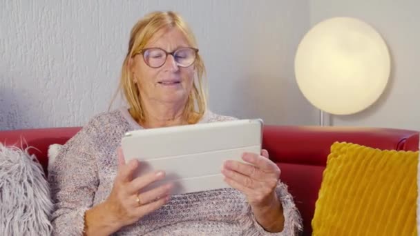 Elderly Woman Looking Tablet Smiling Looking — Stockvideo