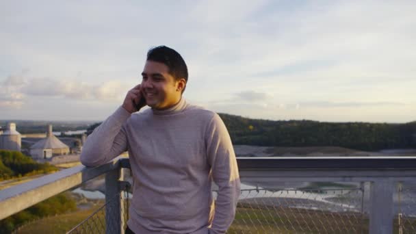 Young Man Turtle Neck Sweater Calling Phone Top Mountain — Stock video