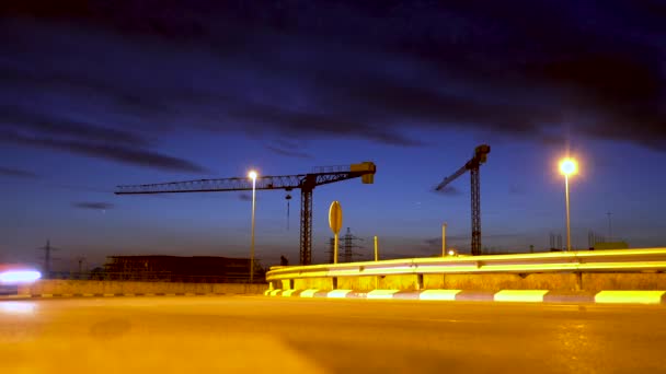 Cars Passing Fast Forward Industrial Zone Cranes Background Dusk — Stock Video