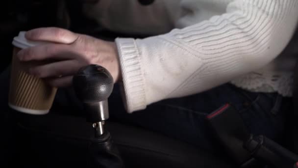 Female Driver Coffee Hands Gear Stick Close Interior Shot — 图库视频影像