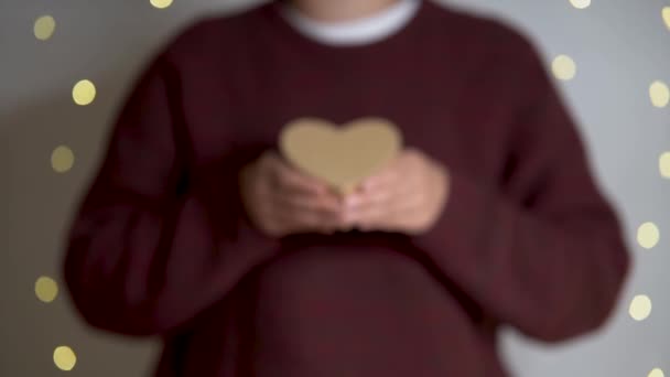 Woman Offers Heart Christmas Lights Background — Stockvideo