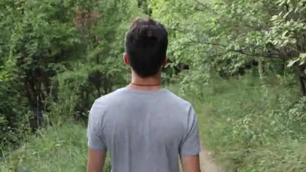 Young Man Walking Forest Summer Time Close Shot Back — Stockvideo