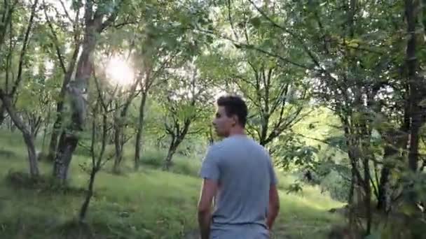 Man Walks Footpath Forest Daytime Summer Season Young Man Filmed — Vídeo de Stock