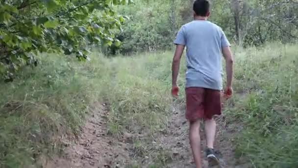 Man Walks Footpath Forest Daytime Summer Season Young Man Filmed — Stock Video