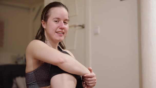 Young Woman Sretching Her Daily Workout Routine Home — Stock Video