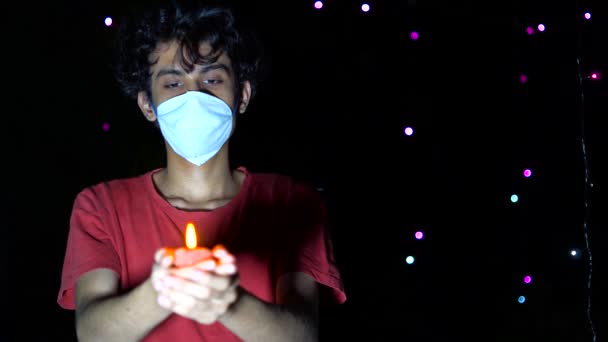 Young Man Celebrating Diwali Festival Medical Mask Diya Oil Lamp — Stock video