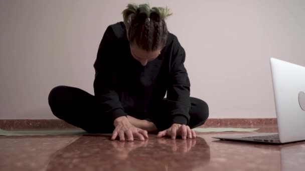 Woman Braids Stretching Her Back Online Yoga Class — Stock video