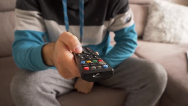 Man Sofa Flipping Channels Remote Control Hand — Stockvideo