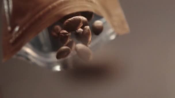 Slow Motion Shot Coffee Beans Falling Out Ground Coffee Bag — Video