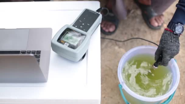 Farmer Measuring Balance Pond Water — Stockvideo