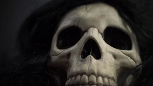 Creepy Skull Black Hair Close Tilting Shot — Stockvideo