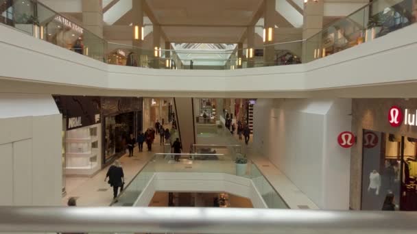 Looking Out Glass Chrome Railing Levels Large Mall Shoppers Walking — Stock videók