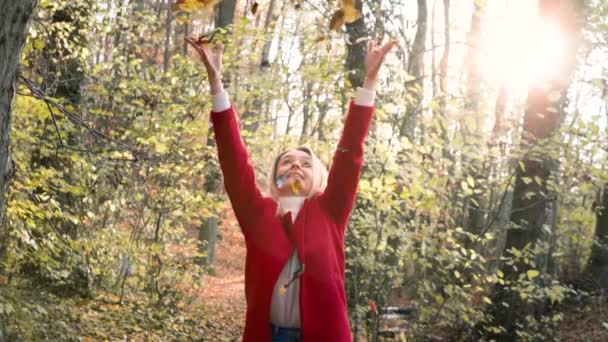 Slowmotion Young Beautiful Woman Throwing Leaves Air Amidst Thee Orange — 图库视频影像