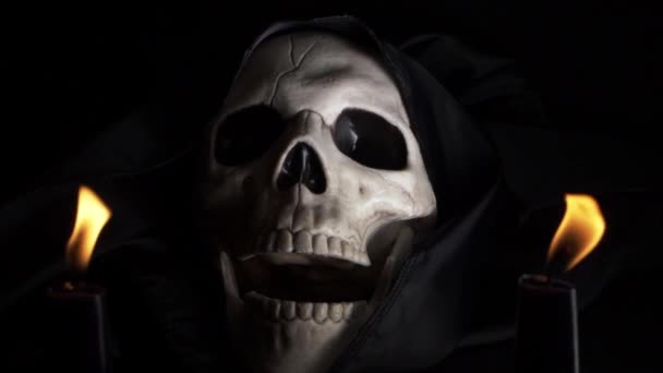 Hooded Skull Open Mouthed Two Candles Dark Background — Vídeos de Stock