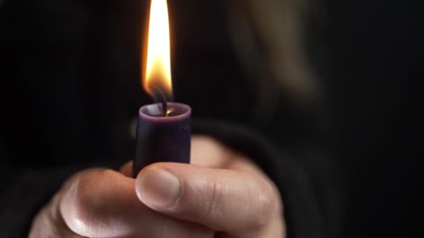 Woman Holding Long Candle Vigil Dark Background Close Shot — Wideo stockowe