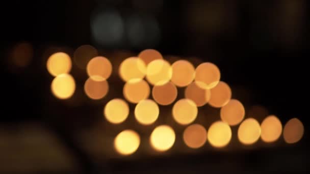 Row Church Candle Flames Warm Bokeh Background — Stockvideo