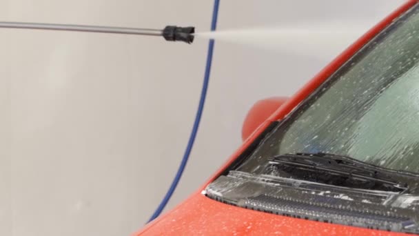 Pressure Hose Cleaning Red Car Car Wash — Stockvideo