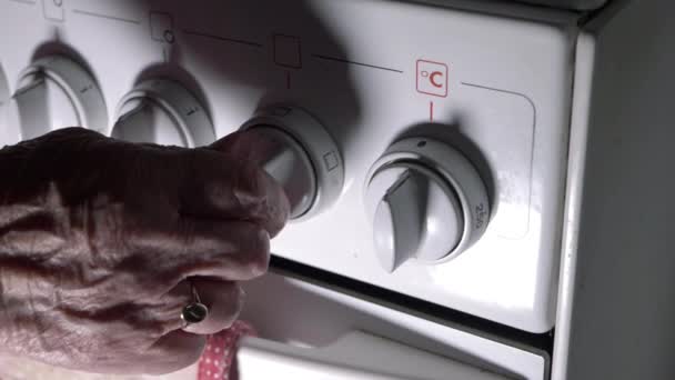 Hands Elderly Lady Turning Oven Dial Close Shot — Video Stock
