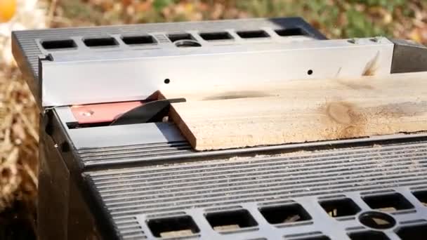 Cedar Wooden Board Being Pushed Metal Table Saw Outdoors Close — Stockvideo