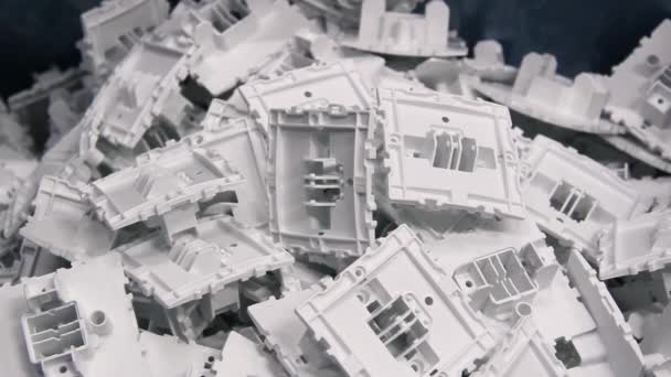 Plastic Electrical Outlet Components Manufactured Bulk Pile — Stock Video
