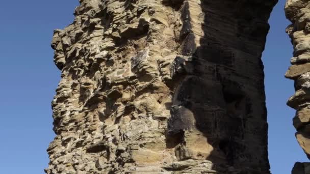 Castle Ruins Archway Blue Sky Medium Panning Shot — Stockvideo